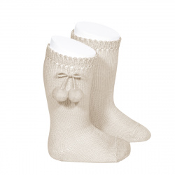 Buy Perle knee high socks with pompoms LINEN in the online store Condor. Made in Spain. Visit the POMPOM BABY SOCKS section where you will find more colors and products that you will surely fall in love with. We invite you to take a look around our online store.