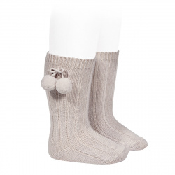 Buy Warm cotton rib knee-high socks with pompoms STONE in the online store Condor. Made in Spain. Visit the POMPOM WARM BABY SOCKS section where you will find more colors and products that you will surely fall in love with. We invite you to take a look around our online store.