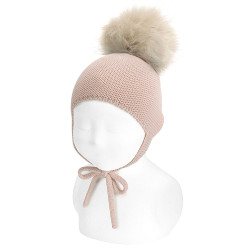 Buy Merino blend baby knit hat w/earflaps &pompom NUDE in the online store Condor. Made in Spain. Visit the Hats and hoods section where you will find more colors and products that you will surely fall in love with. We invite you to take a look around our online store.